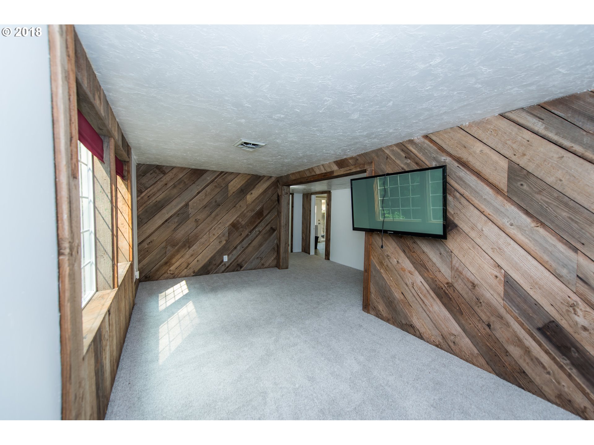 29503 Old Rainier Road Rainier, OR 97048 - Photo 15 of 22 a view of an empty room with wooden floor and a window