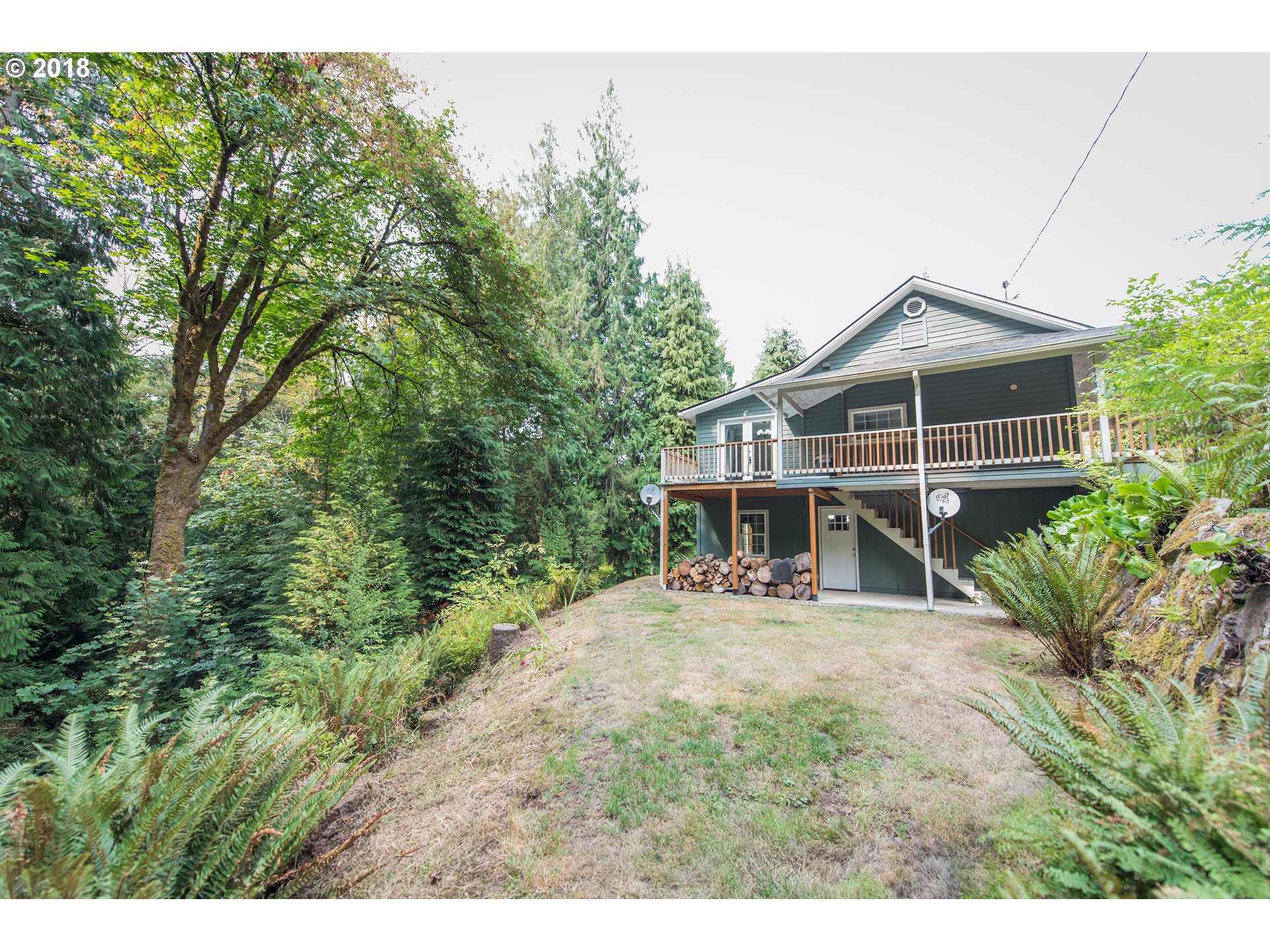 29503 Old Rainier Road Rainier, OR 97048 - Photo 21 of 22 a view of a house with a yard and sitting area
