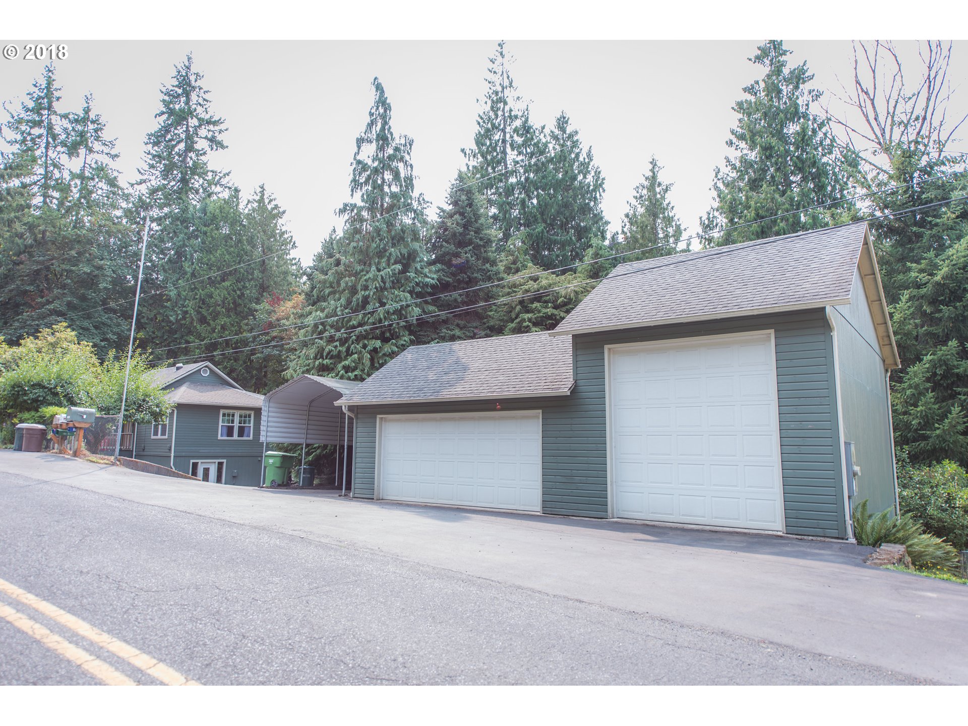 29503 Old Rainier Road Rainier, OR 97048 - Photo 4 of 22 a front view of a house with a yard and garage