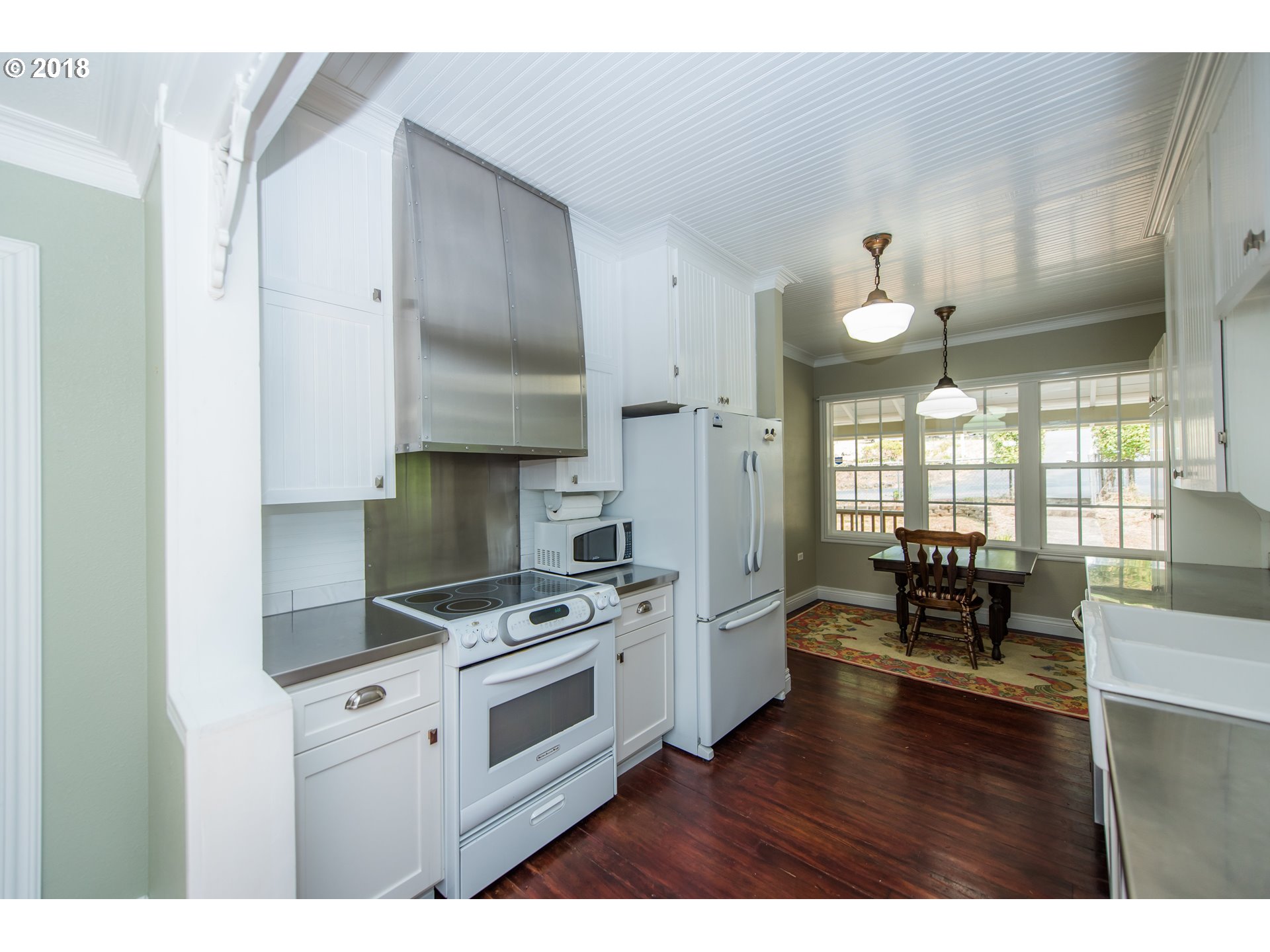29503 Old Rainier Road Rainier, OR 97048 - Photo 10 of 22 a kitchen with granite countertop a stove a sink and a refrigerator