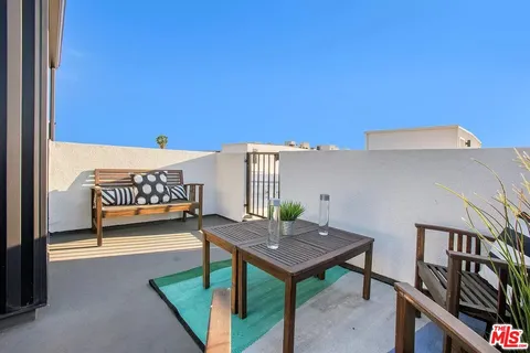 a view of a terrace with furniture