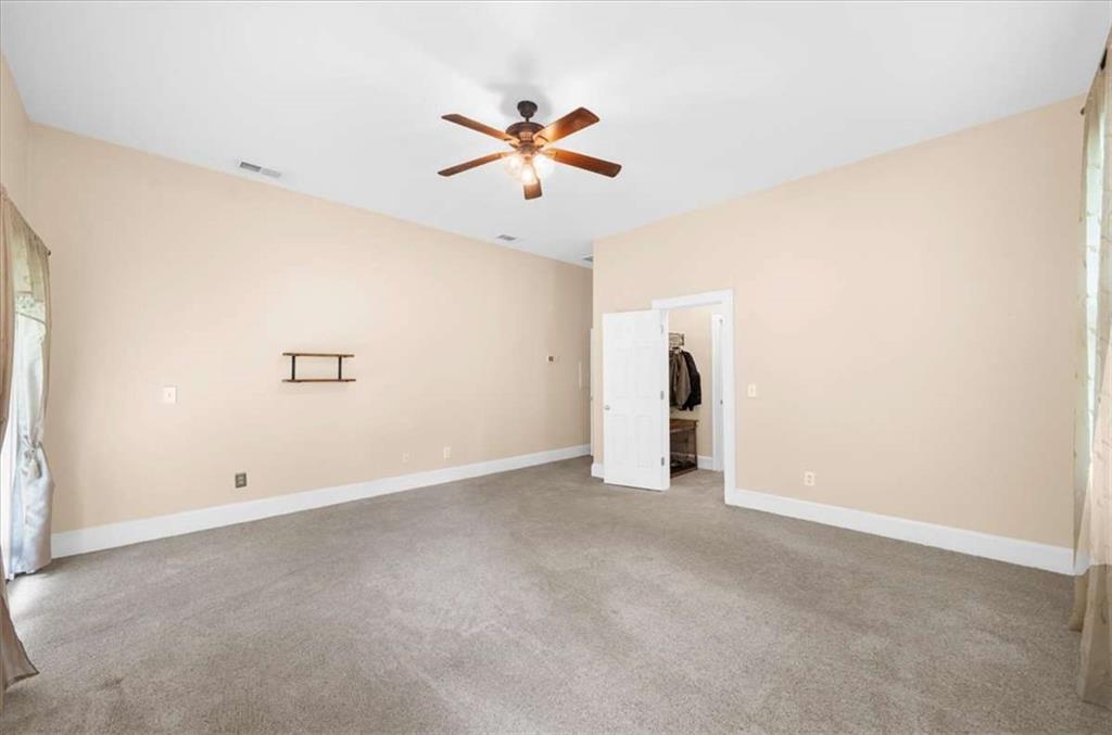 106 Westmore Road Southwest Rome, GA 30165 - Photo 39 of 56 an empty room with ceiling fan and window