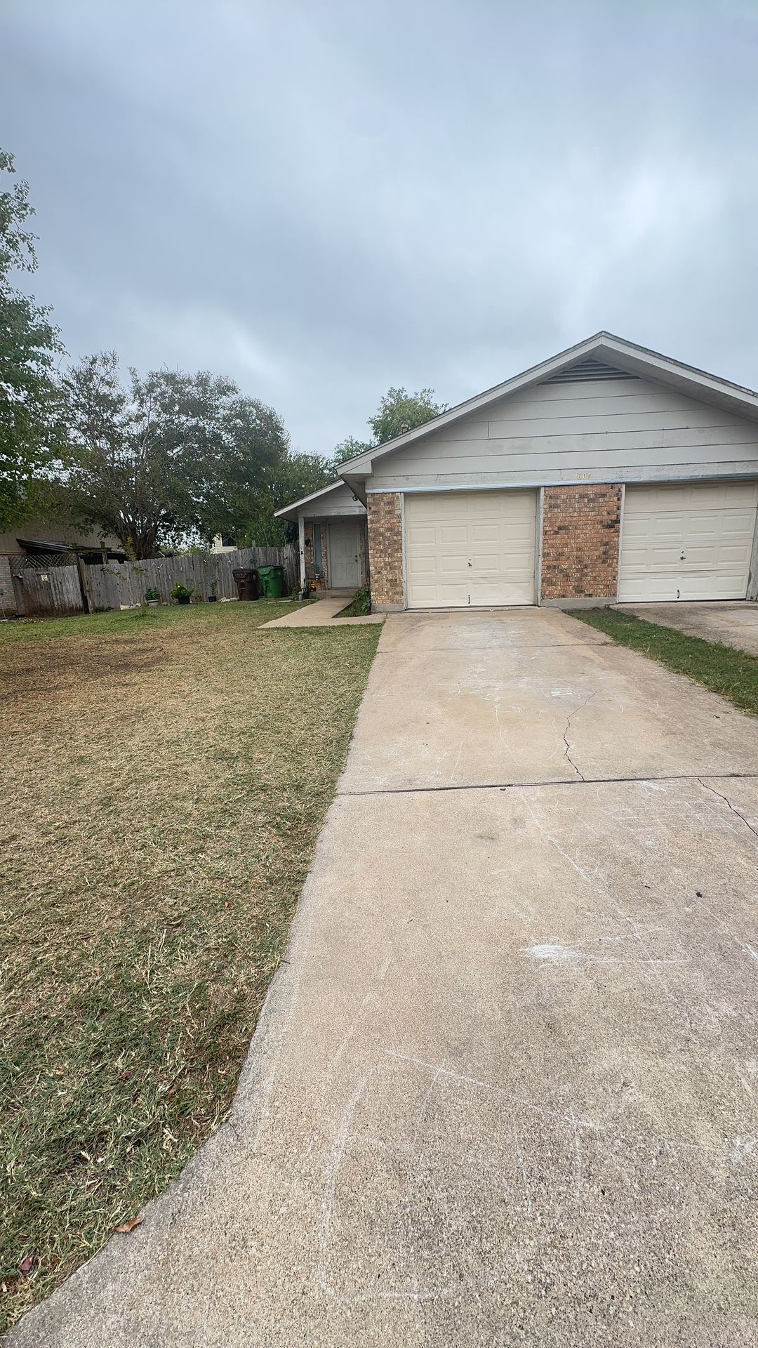 a front view of house with yard space and seating