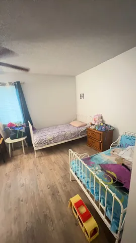 a bedroom with furniture and a window