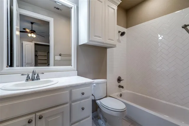 a bathroom with a sink a toilet and a bathtub