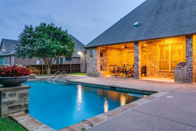 a view of swimming pool from a balcony