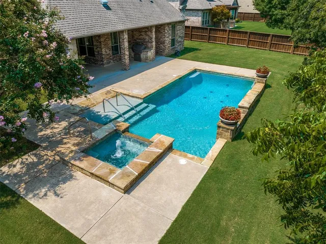 a view of a backyard with chairs