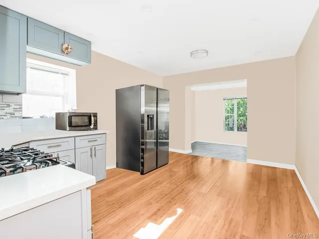 a kitchen with a refrigerator stove and sink