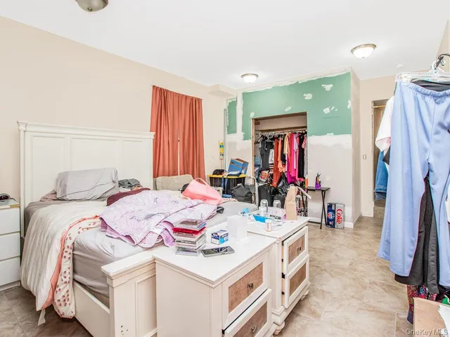 a kitchen with cabinets stainless steel appliances and wooden floor