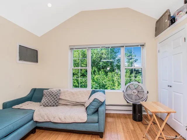 a bathroom with a bathtub shower sink vanity and a toilet