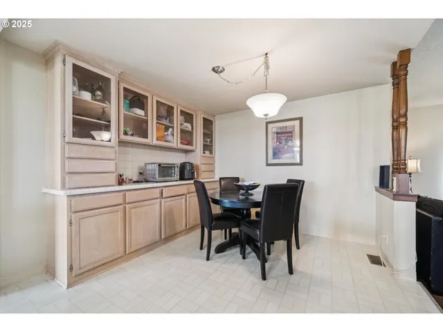 a living room with a couch and dresser