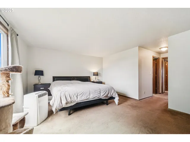 a bathroom with a granite countertop sink a mirror and a toilet