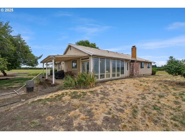 a view of a backyard of the house