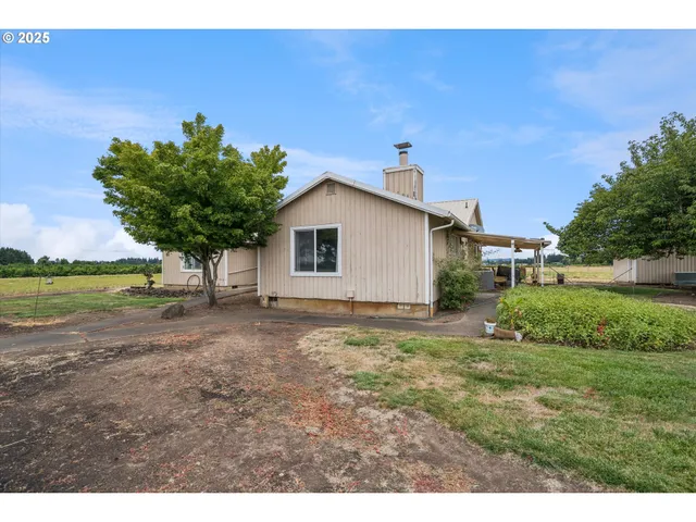 a backyard of a house with lots of green space