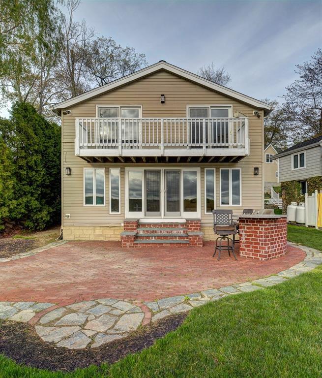 63 Meeks Point Road East Hampton, CT 06424 - Photo 1 of 1 a front view of a house with a garden and chairs
