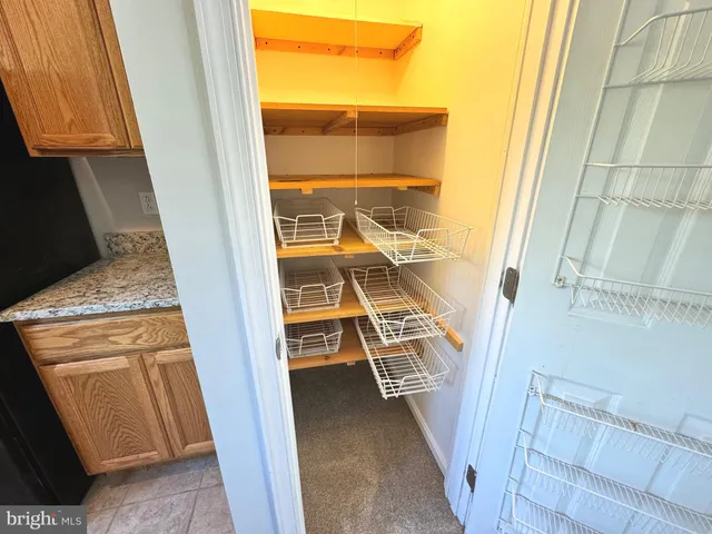 a view of an empty room and wooden floor