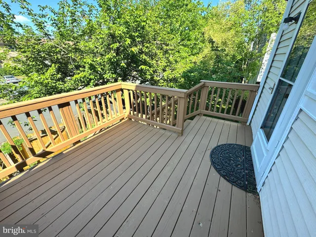 a balcony with wooden floor in outdoor space