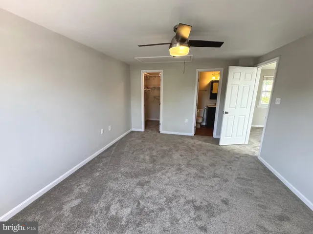 a bathroom with a shower and a mirror