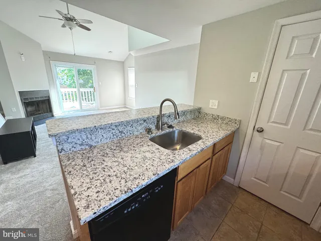 a kitchen with a stove a sink and a microwave