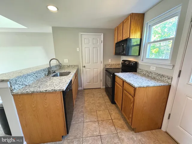 a room with a couch and a rug