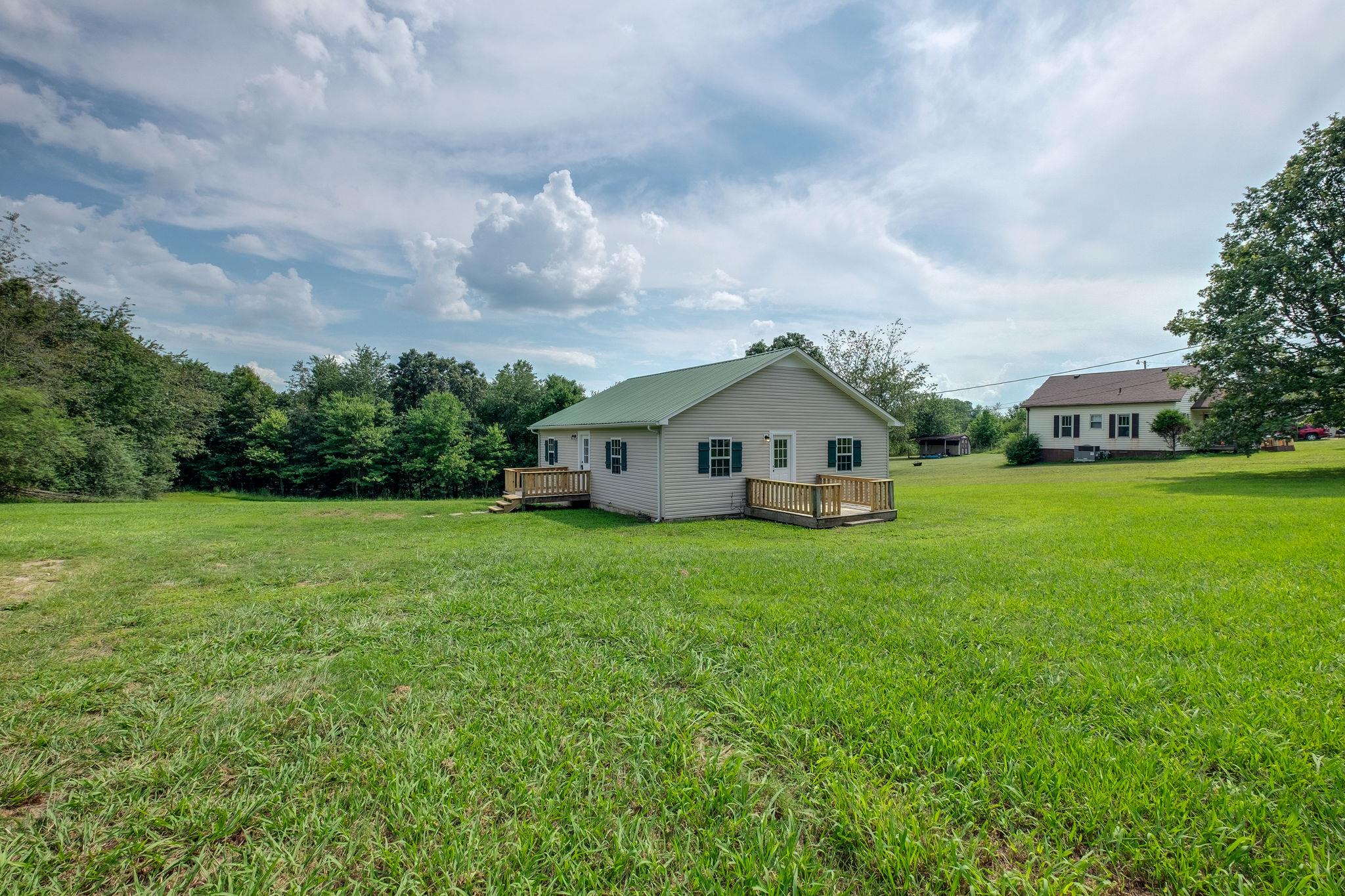 1671 Eno Road Dickson, TN 37055 - Photo 11 of 24 a house view with a garden space
