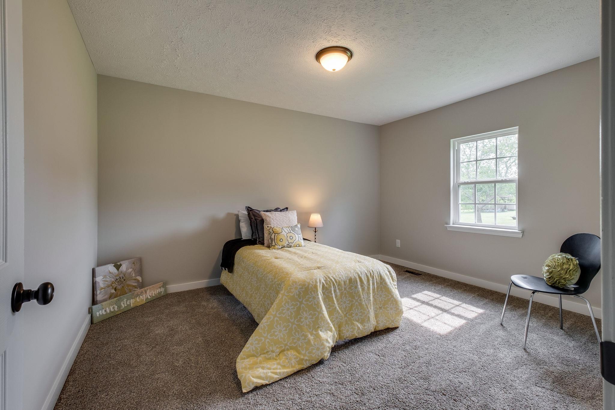 1671 Eno Road Dickson, TN 37055 - Photo 16 of 24 a bedroom with a bed and window