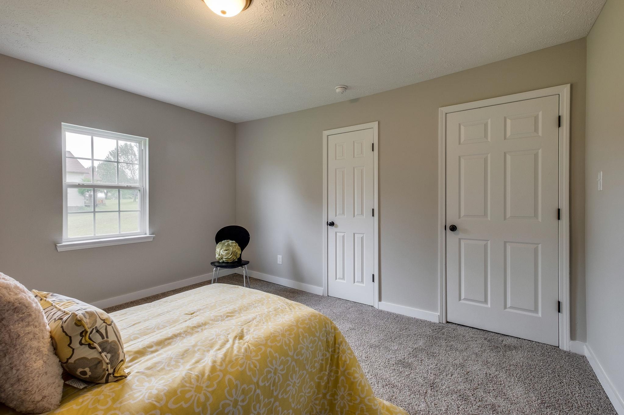 1671 Eno Road Dickson, TN 37055 - Photo 18 of 24 a bedroom with a bed and a window