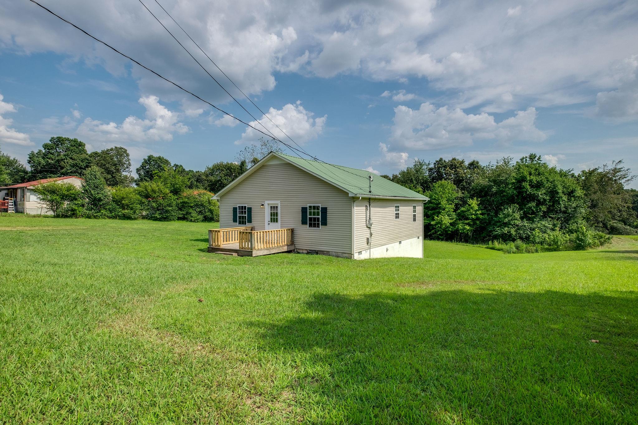 1671 Eno Road Dickson, TN 37055 - Photo 23 of 24 a front view of house with yard and green space