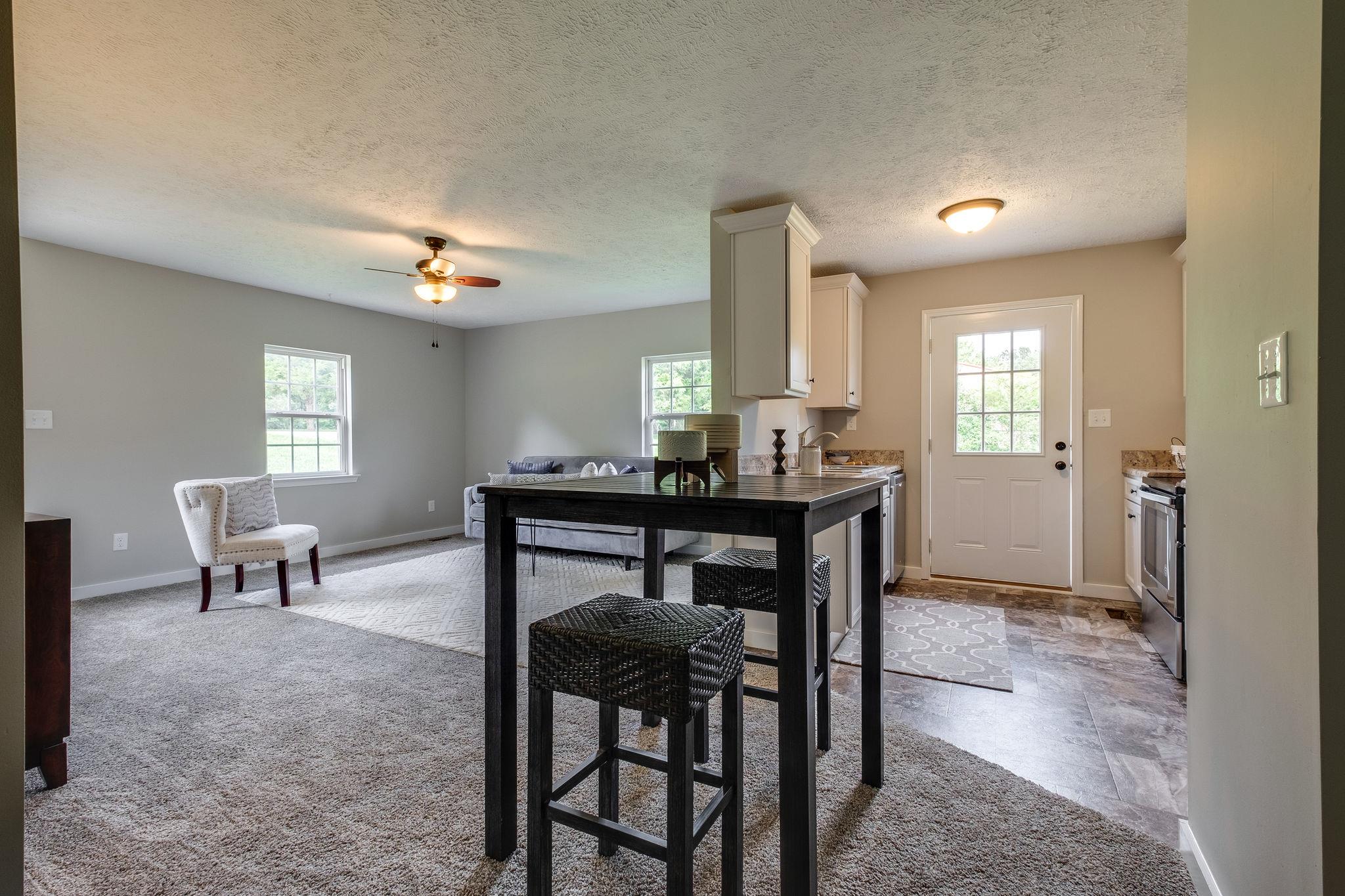 1671 Eno Road Dickson, TN 37055 - Photo 5 of 24 a view of a livingroom with furniture and window