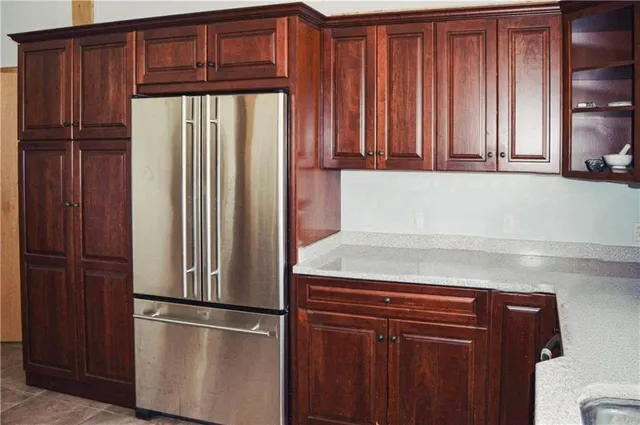 a kitchen with stainless steel appliances granite countertop a stove and a sink