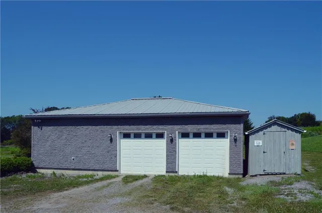 a front view of house with garage