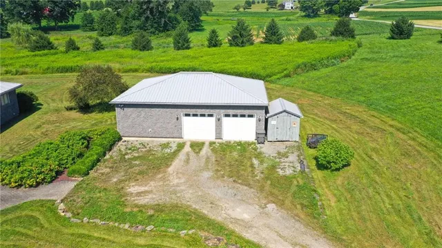 a aerial view of a house with big yard