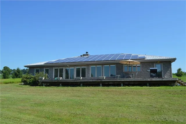 a view of a room with table and a potted plants
