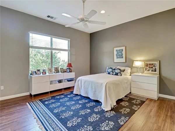 a bed room with a bed and a window