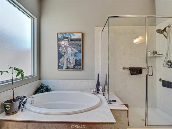 a bathroom with a tub and shower