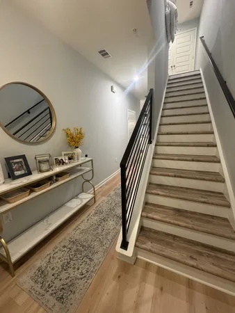 a bathroom with a sink a mirror and a shower