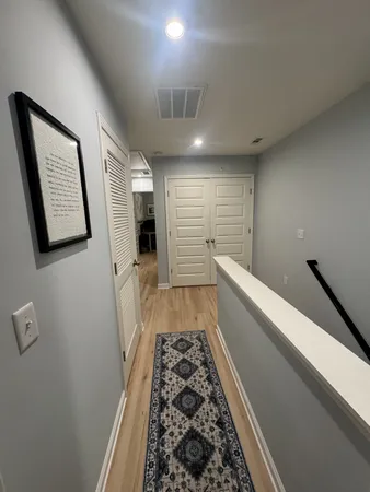 a bathroom with a toilet and a window