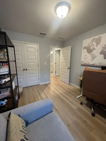 a bedroom with a bed and a table