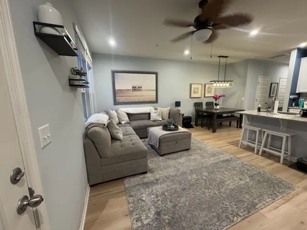 a kitchen with stainless steel appliances a stove refrigerator sink and microwave