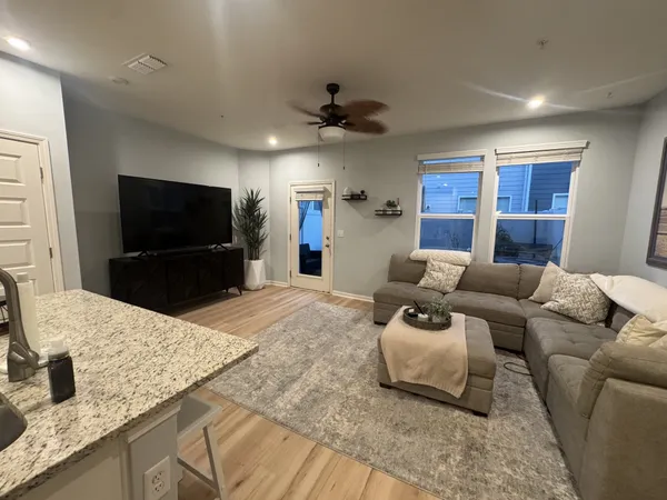 a kitchen with refrigerator cabinets and furniture