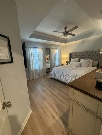 a bedroom with a bed and flat screen tv