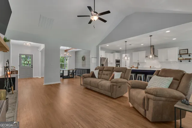 a large kitchen with a table and chairs