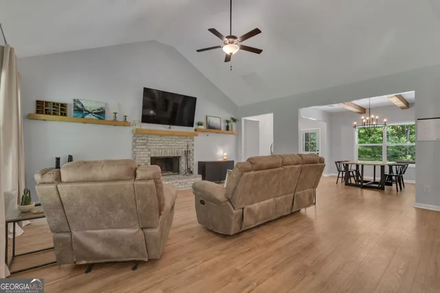 a large kitchen with kitchen island lots of counter space a sink appliances and cabinets