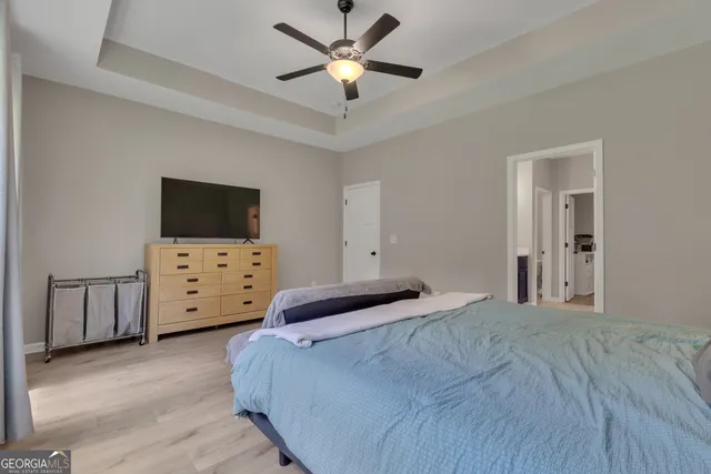 a white toilet sitting next to a small bathroom sink