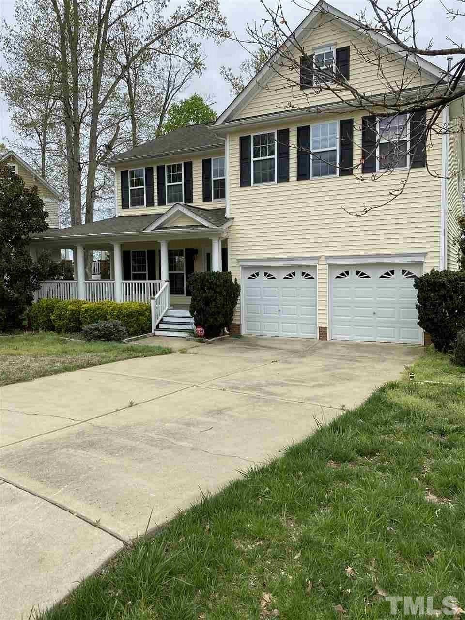 178 Locke Woods Road Raleigh, NC 27603 - Photo 1 of 3 a view of a white house with a big yard and large trees