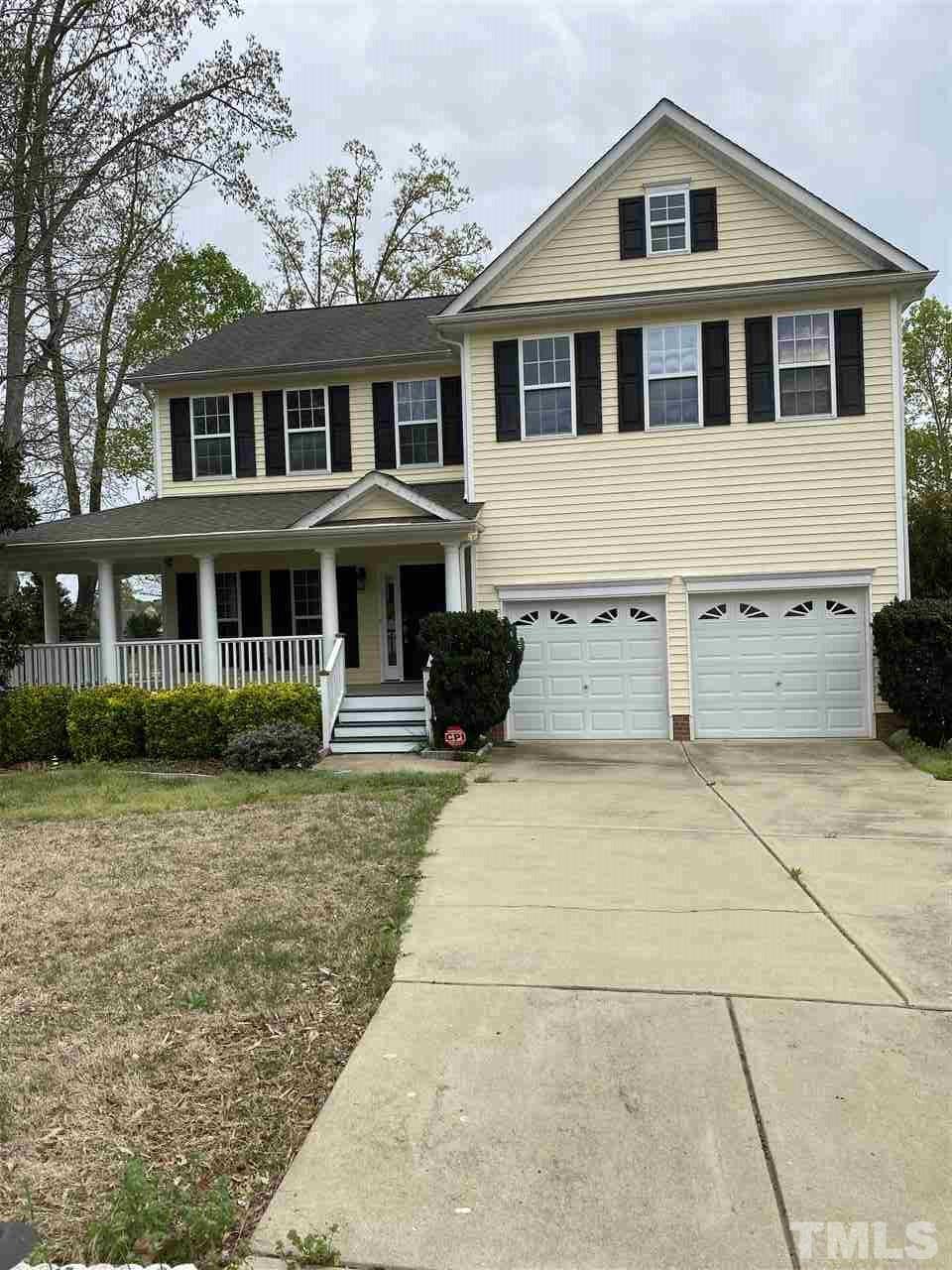 178 Locke Woods Road Raleigh, NC 27603 - Photo 2 of 3 a front view of a house with a yard