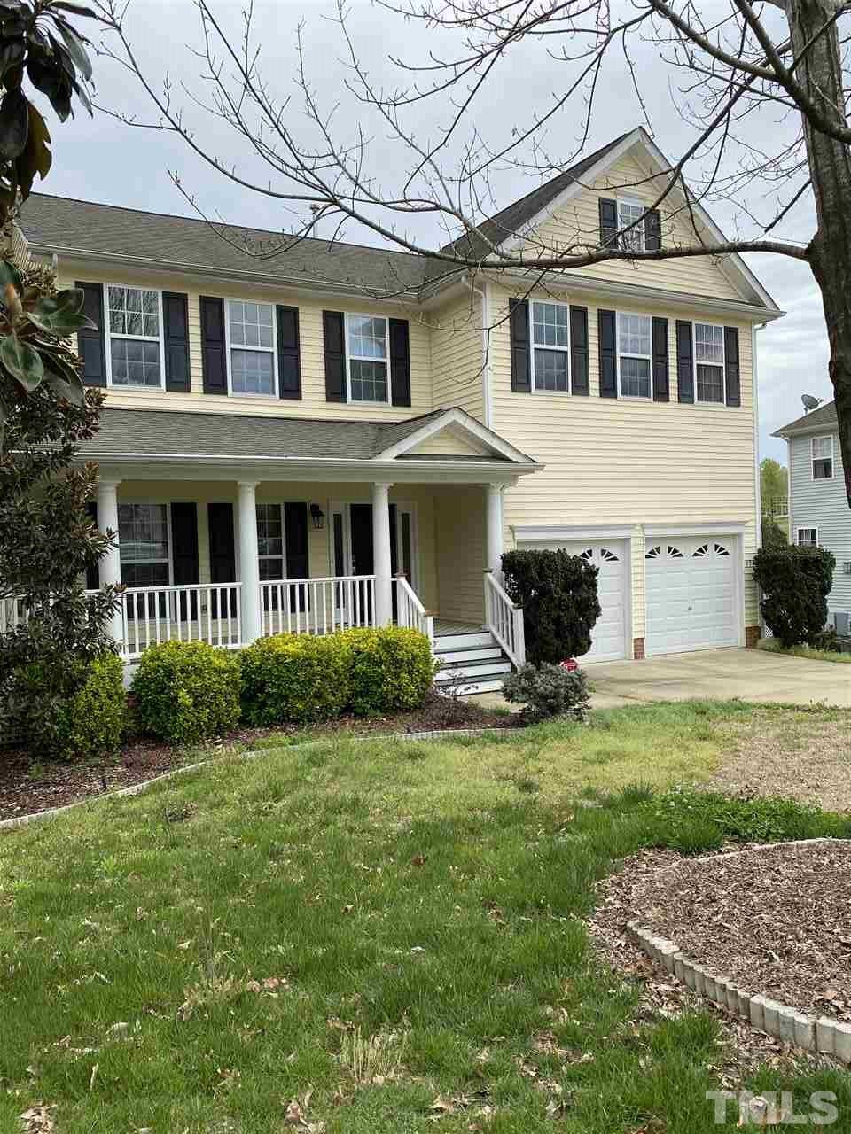 178 Locke Woods Road Raleigh, NC 27603 - Photo 3 of 3 a front view of a house with a garden