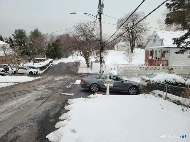 a view of a street with cars