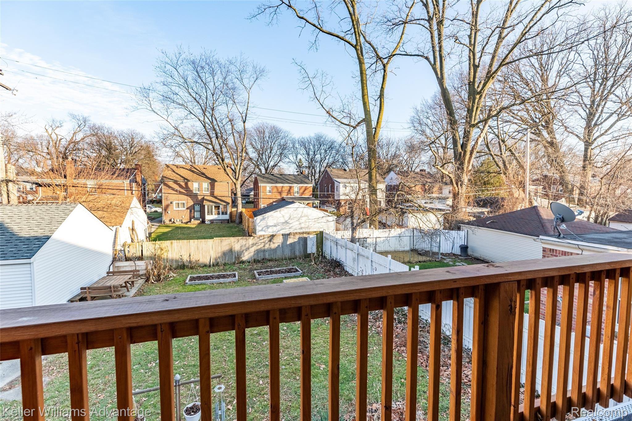 14044 Greenview Road Detroit, MI 48223 - Photo 18 of 28 14044 Greenview Rd, Detroit, MI 48223 - Balcony overlooking Partially Fenced Backyard
