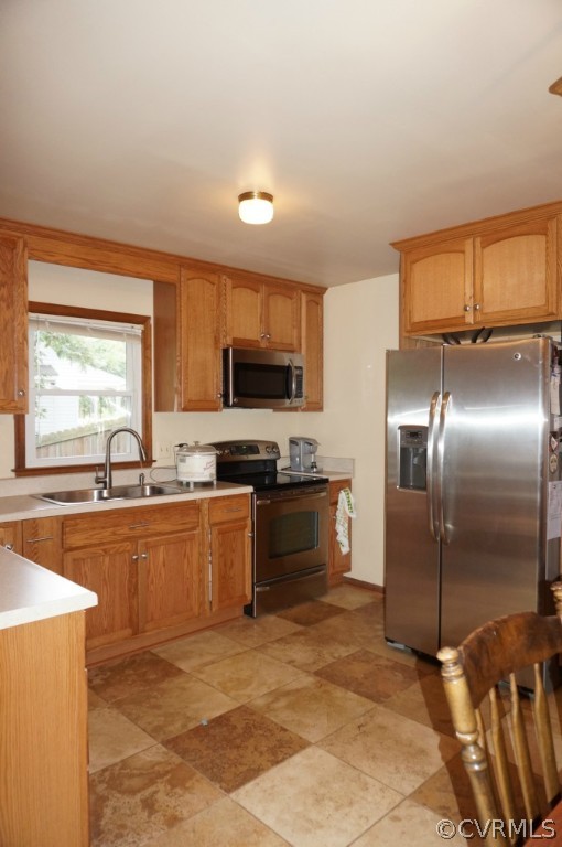 7012 Full Rack Drive Midlothian, VA 23112 - Photo 11 of 24 a modern kitchen with stainless steel appliances granite countertop a stove top oven a sink dishwasher a refrigerator and cabinets with wooden floor